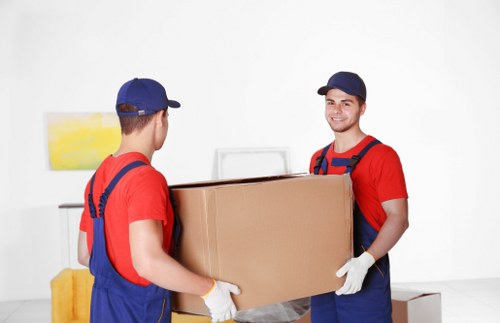 Man and van loading furniture in Barnet on a local residential street