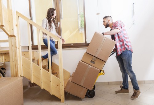 Furniture removal team working in a Barnet flat building